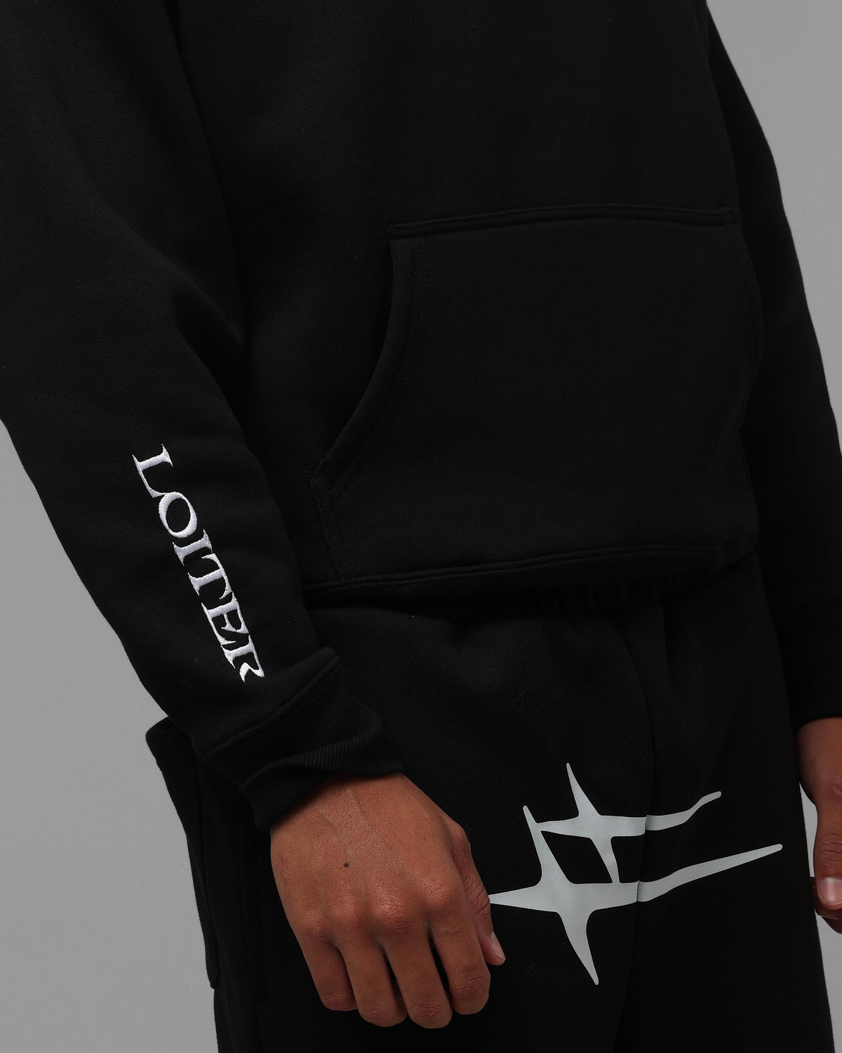 Black Pullover Hoodie with Printed Graphics and Embroidered Accents, Dropped Shoulder Design